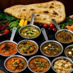 Selection of Indian curry, Naan and Tandoro with contours and spices - Traditional Street Food of North India
