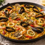 Paella algherese di mare con cozze, vongole, gamberi e calamari - Foto VGAI
